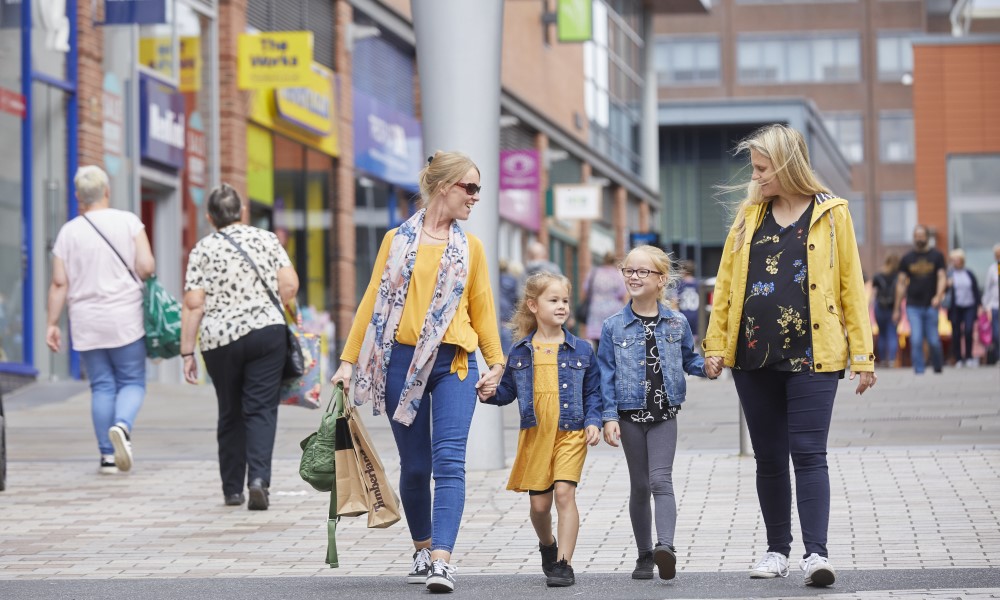 Family walking along Trinity Walk